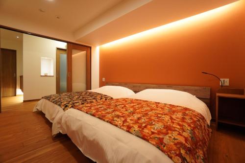 a hotel room with two beds in a room at Bird Hostel in Kyoto