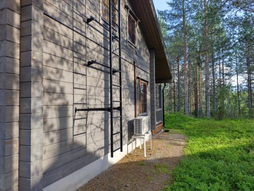 a wall of a house with a window on it at Ruka Star in Ruka