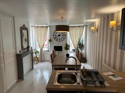 a kitchen with a sink and a counter top at maison 4 personnes tout confort alentours boulogne sur mer in Samer