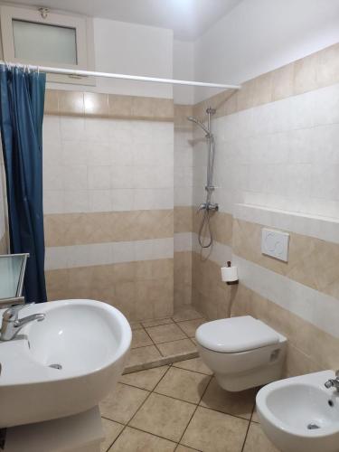 a bathroom with a sink and a toilet and a shower at Casa vacanza Tanja Leuca in Leuca