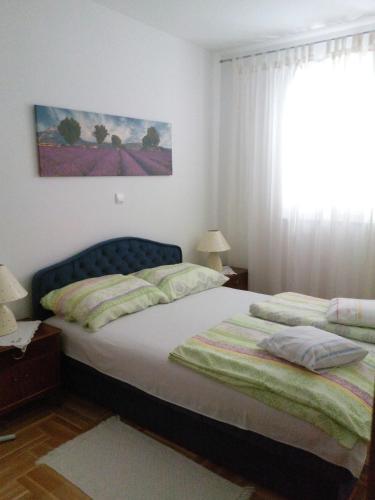 Gulta vai gultas numurā naktsmītnē Apartment Z&E