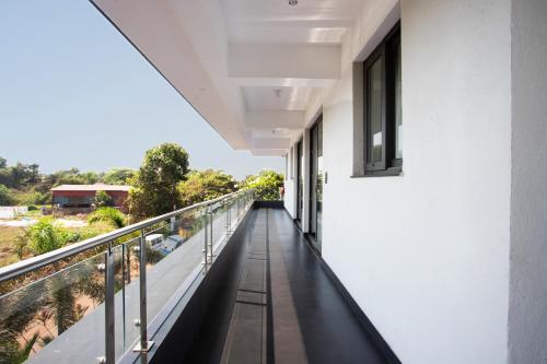 a balcony of a building with a view at Crystal Village in Nagoa-Bardez