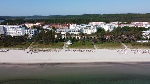 an aerial view of a beach with a group of people at Rugard Thermal Strandhotel in Binz
