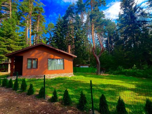 a small house in the middle of a yard at Villa Capricorn in Tsigov Chark