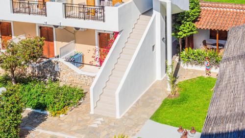 an aerial view of a house with stairs and a yard at Almira Hotel in Troulos