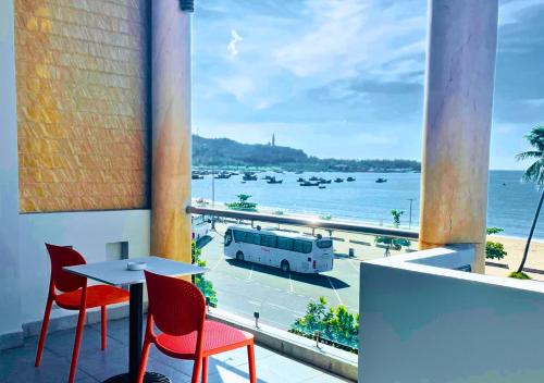 a balcony with a table and chairs and a view of the ocean at Sontra Sea Hotel in Da Nang