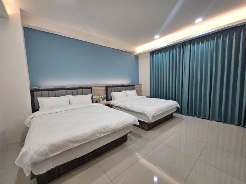 Postel nebo postele na pokoji v ubytování Hongyue Holiday B&B