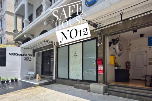 a store front of a store with a sign on it at Townhouse at Yaek Lam Sali station for 6 pax in Ban Bang Toei (1)