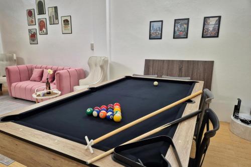 a living room with a pool table with balls at Townhouse at Yaek Lam Sali station for 6 pax in Ban Bang Toei (1)