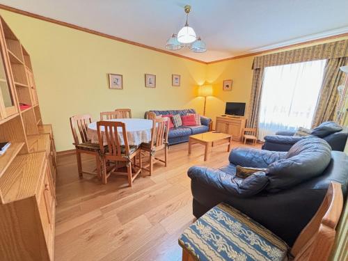a living room with a couch and a table at Two bedroom apartment near beach and Casino in Figueira da Foz