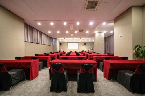 a conference room with red tables and chairs at Best Western Plus Jeonju in Jeonju
