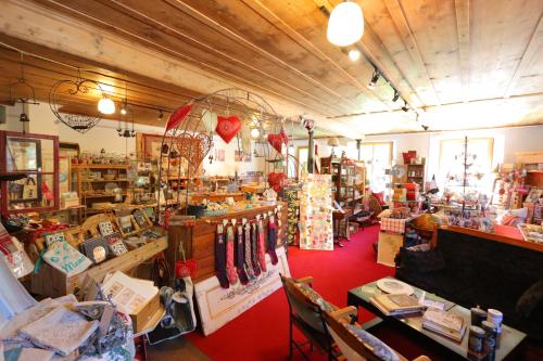 a store filled with lots of items in a room at La Reine des Prés in La Tine