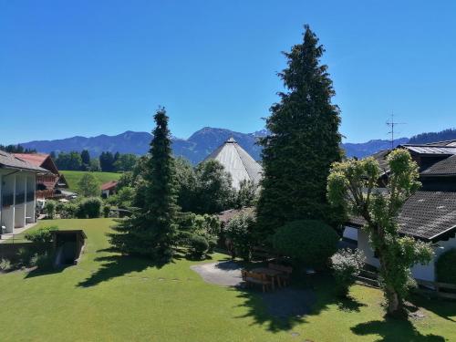 an overhead view of a yard with trees and a building at Haus Obermaiselstein in Obermaiselstein