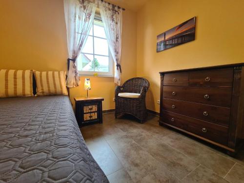 Katil atau katil-katil dalam bilik di Bungalow Leuchtturmblick Bastorf nahe Kühlungsborn