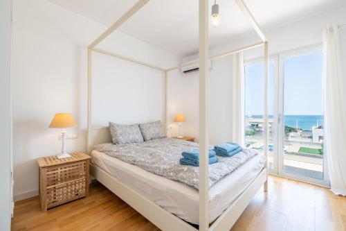 En eller flere senge i et værelse på Casa Olivera De Farrutx