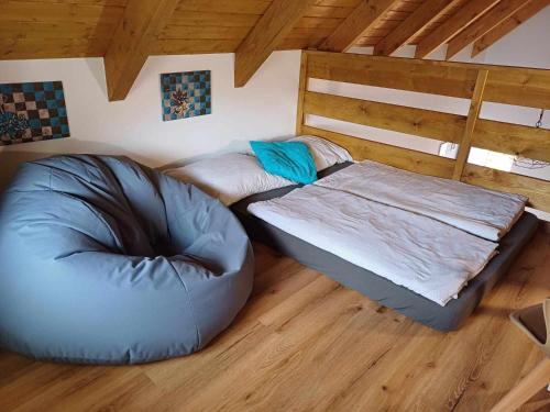 Postel nebo postele na pokoji v ubytování Apartmány Máchovo jezero