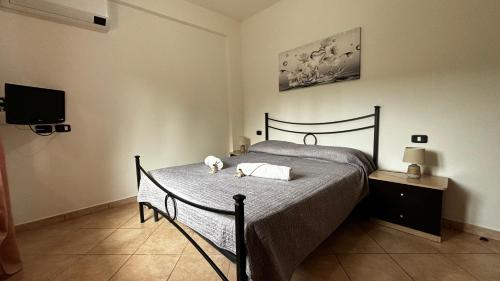 Giường trong phòng chung tại Sognando il cilento