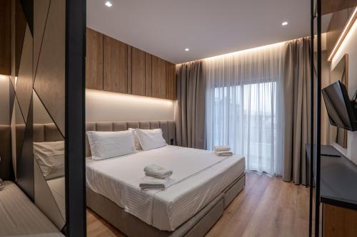 Postel nebo postele na pokoji v ubytování Arel Hotel