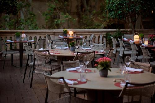 a group of tables and chairs on a patio at Can Alomar Hotel in Palma de Mallorca