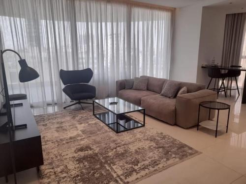 a living room with a couch and a table at 360 Building - City View 2 Bedroom Residence in Nicosia