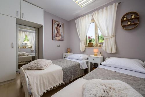 Postel nebo postele na pokoji v ubytování Villa Vidova