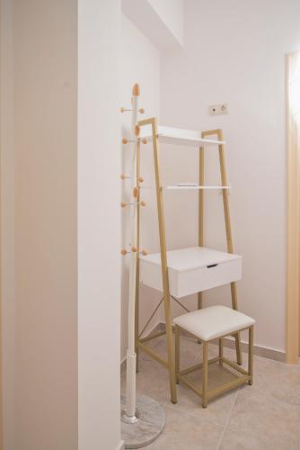 a wooden bunk bed with a chair in a room at Kastoras Apartments in Kardamili