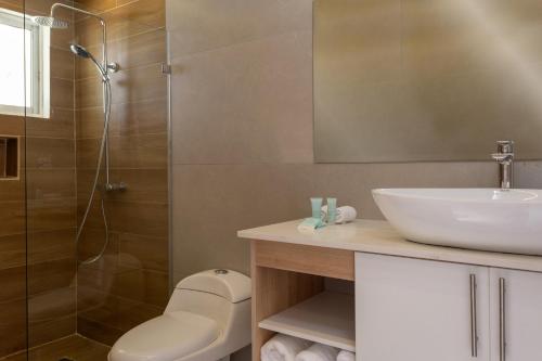 a bathroom with a sink and a shower at Hotel HM Alma de Bayahibe - Adults Only - All Inclusive in Bayahibe