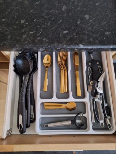 a drawer filled with utensils on top of a counter at Cinematic Journeys in Nottingham
