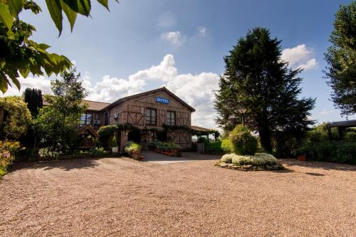 a large house with a large yard in front of it at Vakantiehuis De Stokerij in Oudenburg