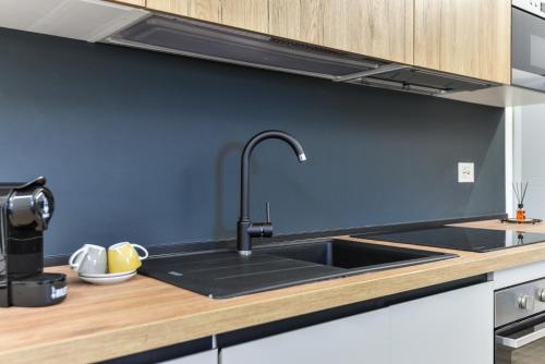 a kitchen with a sink and a counter top at Casina Napoleonica in Lacona