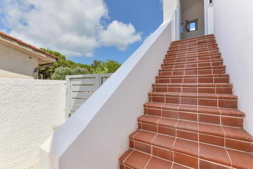 a set of stairs leading up to a house at Casina Napoleonica in Lacona