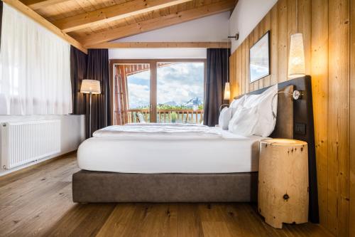 Postel nebo postele na pokoji v ubytování Alpine Hotel Gran Foda'