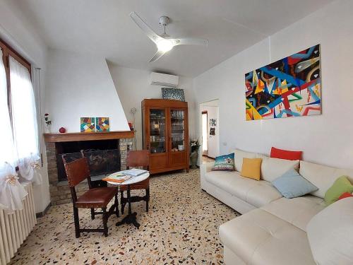 a living room with a couch and a table at Chianti Best House in Greve in Chianti