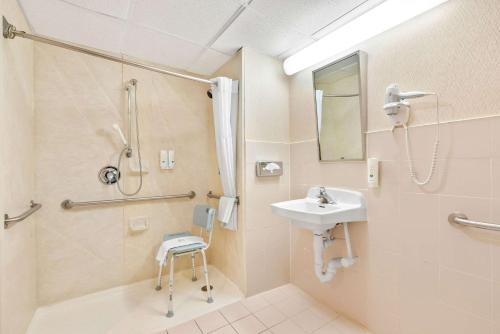 a bathroom with a sink and a shower at Quality Inn Edison-New Brunswick in Edison