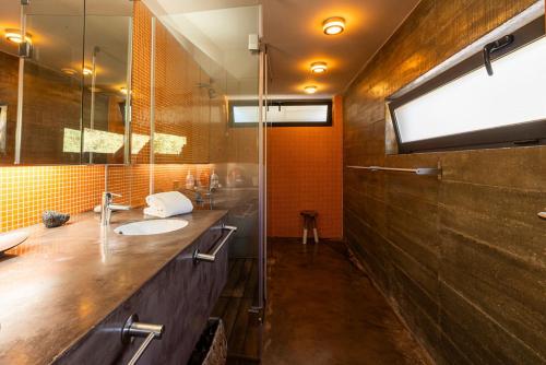 a bathroom with a sink and a mirror at The Pine Tree Comporta Villa in Carvalhal