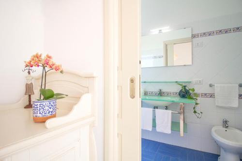 a bathroom with a sink and a toilet at LA CASA DEL SOLE - Beachfront B&B - Anzio in Anzio
