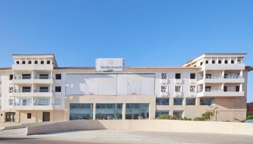 a building with a skate park in front of it at Golden Palace Marina Hotel in El Alamein