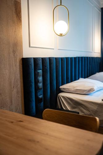 Ένα ή περισσότερα κρεβάτια σε δωμάτιο στο Apartamenty Branicka