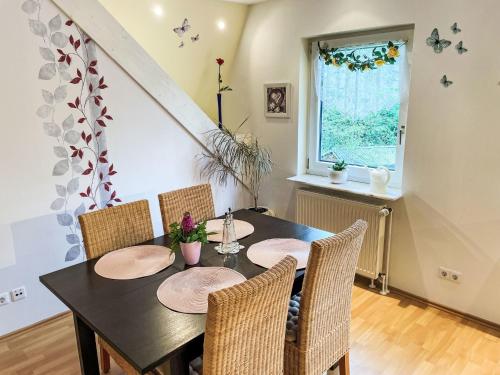 a dining room with a table and chairs and a window at Apartment Winona by Interhome in Wanna