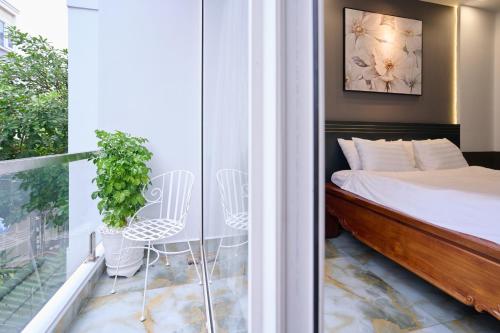 Postel nebo postele na pokoji v ubytování GALANG HOTEL