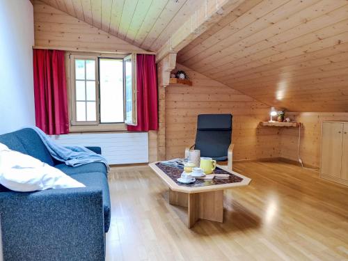 a living room with a couch and a table at Apartment Bühl by Interhome in Achseten
