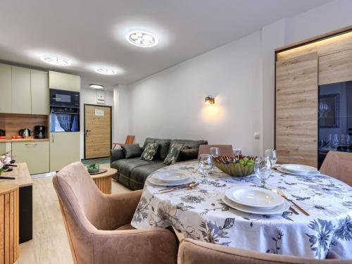 a living room with a table and a couch at Apartment Darja by Interhome in Novigrad Istria