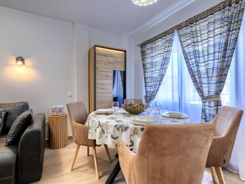 a dining room with a table and chairs at Apartment Darja by Interhome in Novigrad Istria