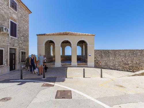 a group of people standing in front of a building at Apartment Darja by Interhome in Novigrad Istria