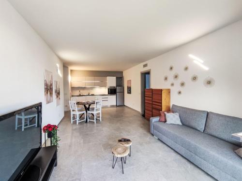 a living room with a couch and a table at Apartment Arianna by Interhome in Arco