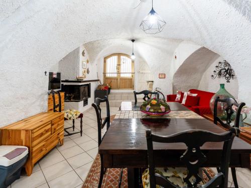 a kitchen and living room with a table and chairs at Holiday Home Ca da Nair by Interhome in Castellaro