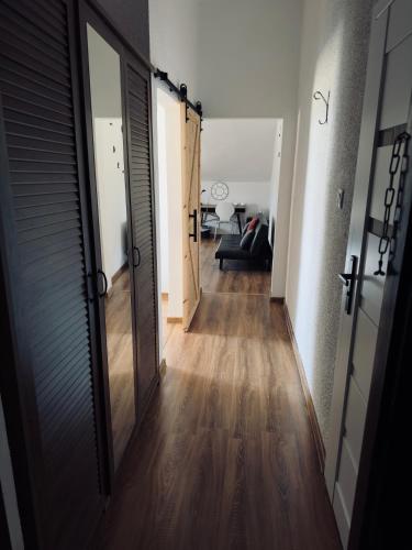 Ένα ή περισσότερα κρεβάτια σε δωμάτιο στο Pensjonat Pod Wozem