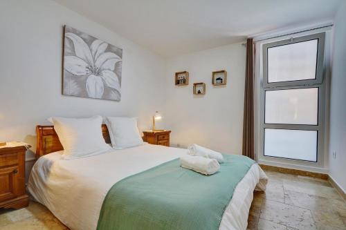 Ένα ή περισσότερα κρεβάτια σε δωμάτιο στο Kaz Emara maison avec jacuzzi
