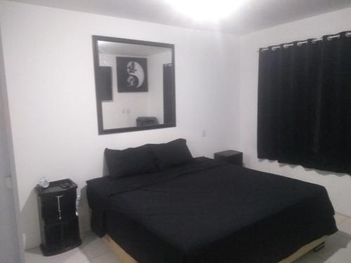 Katil atau katil-katil dalam bilik di Casa com piscina próxima ao Mar