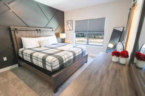 a bedroom with a large bed and a window at 216 Oasis Magic 4BD Villa 5 Min to Disney Magic in Loughman